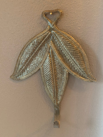 leaf hook made in haiti out of recycled oil drums