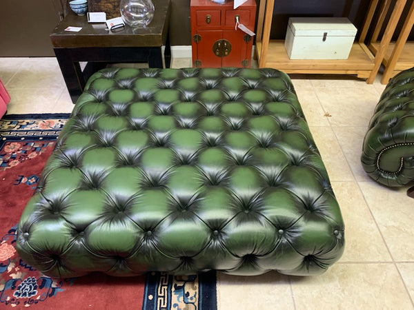 tufted stool in green leather