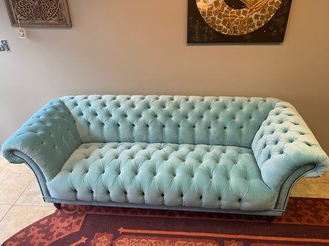 tufted sofa in pale blue velvet