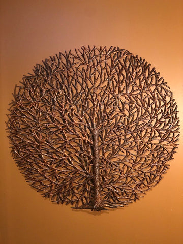 bronze round tree of life made in haiti from recycled oil drums
