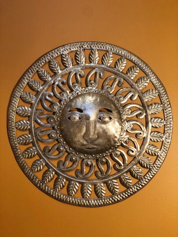embellished sun made in haiti from recyled oil drums