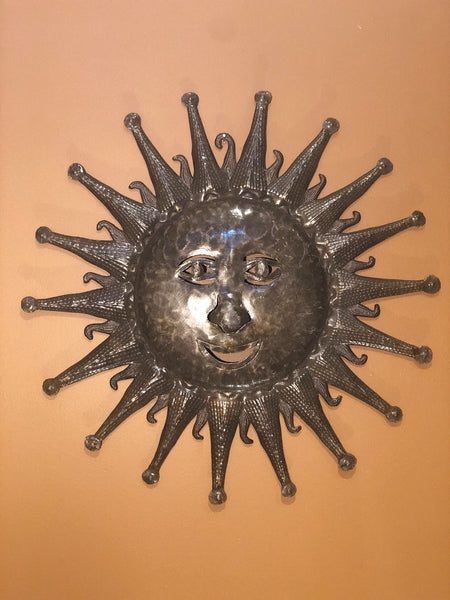 happy sun made in haiti out of recycled oil drums