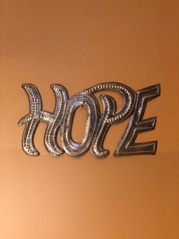 hope sign made in haiti from recycled oil drums