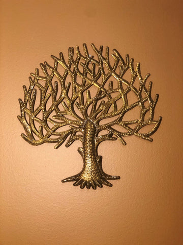 gold tree of life made in haiti from recycled oil drums